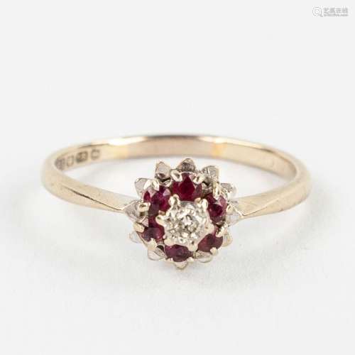 A white-gold ring with cut rubies and a brilliant, made in B...