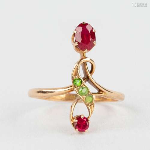 A yellow gold ring, decorated with semi- or precious stones ...