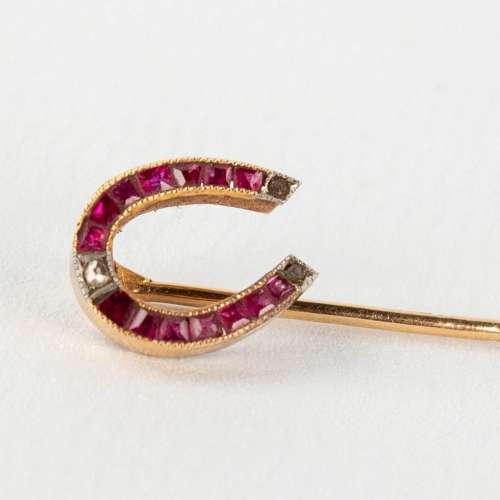 An antique Brooch, 18 karat gold finished with semi- or prec...