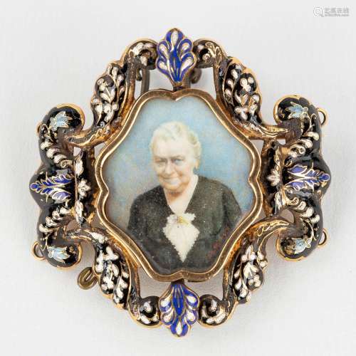 An antique brooch/stand, decorated with enamel and finished ...