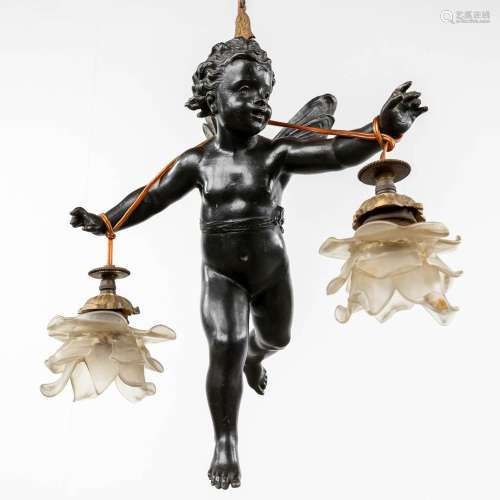 A hall lamp with a putto figurine, patinated bronze. Circa 1...
