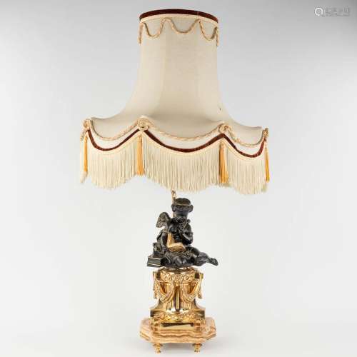A table lamp with a reading angel figurine, bronze. 20th C. ...