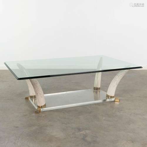 A mid-century faux tusk coffee table, acrylic and glass. Cir...