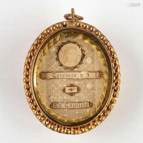 A sealed theca with a relic Ex Capilis S. Teresia à Jesu Inf...