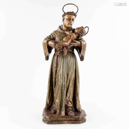An antique wood-sculptured and polychrome figurine of Saint ...