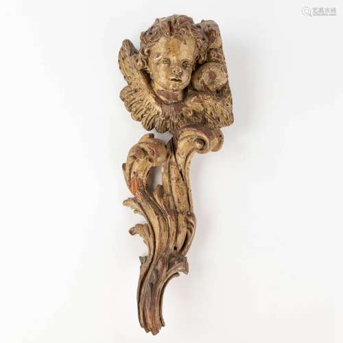 An antique wood-sculptured angel figurine. 18th/19th century...