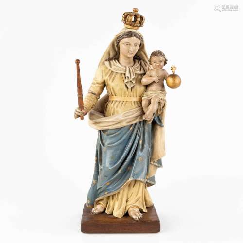 An antique wood-sculptured and polychrome statue of Madonna ...