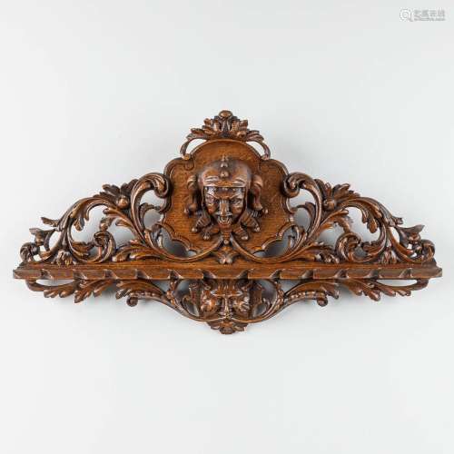 An antique wood-sculptured wall rack for spoons, decorated w...