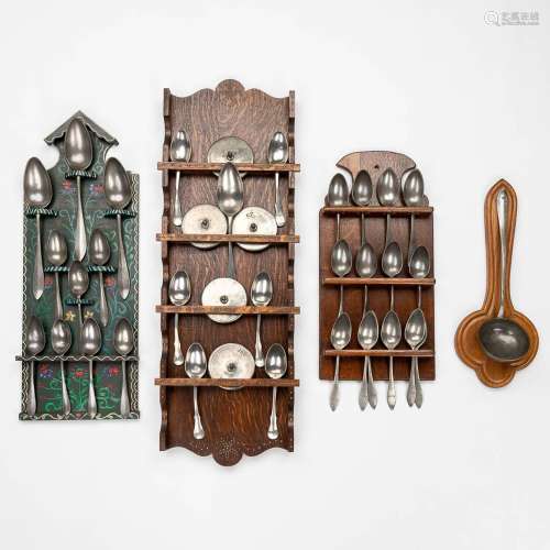 A large collection of antique tin spoons and ladles, some ma...