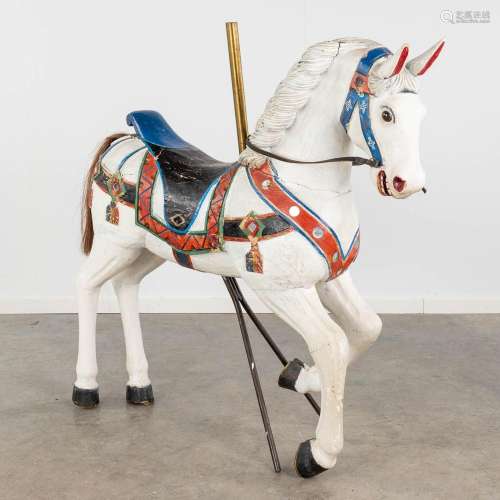 A large carrousel horse, sculptured and patinated wood. (L: ...