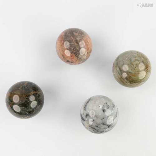 A set of 4 balls made of natural stone and marble. 20th cent...