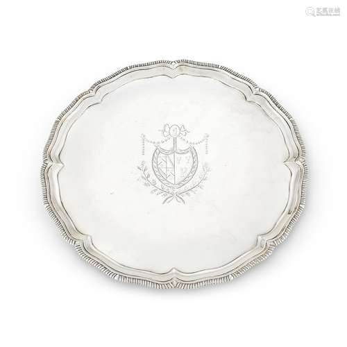 A GEORGE III IRISH SILVER SHAPED CIRCULAR SALVER