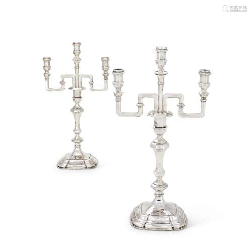 A PAIR OF CONTINENTAL SILVER THREE LIGHT CANDELABRA