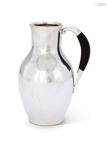 Y GEORG JENSEN, A DANISH SILVER COLOURED WATER JUG OR PITCHE...