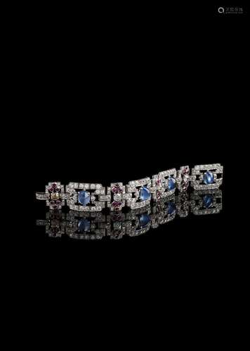 AN AMERICAN 1930S DIAMOND, SAPPHIRE AND RUBY BROAD BRACELET