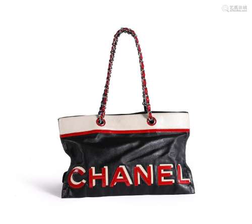 CHANEL, NO. 5 STAR, A BLACK, RED, WHITE AND BLUE LEATHER HAN...