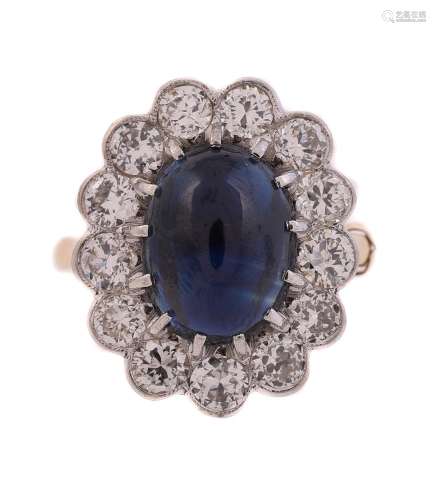 AN 18 CARAT GOLD, SAPPHIRE AND DIAMOND CLUSTER RING, LONDON ...
