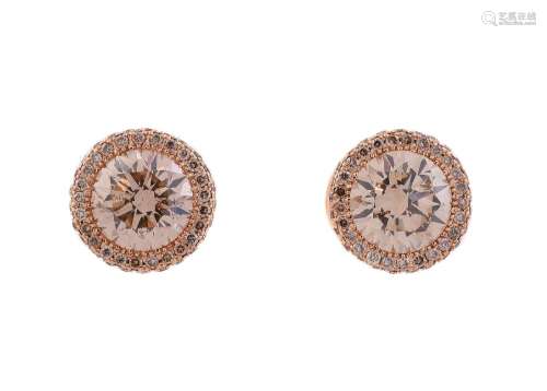 A PAIR OF TINTED DIAMOND CLUSTER EAR STUDS