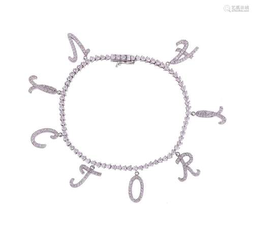 A DIAMOND SET 'VICTORIA' CHARM BRACELET