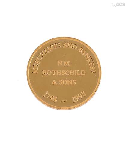 A 14 CARAT GOLD COMMEMORATIVE MEDAL