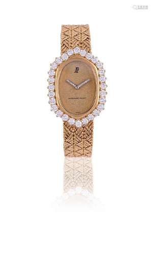 AUDEMARS PIGUET, A LADY'S GOLD COLOURED AND DIAMOND BRACELET...