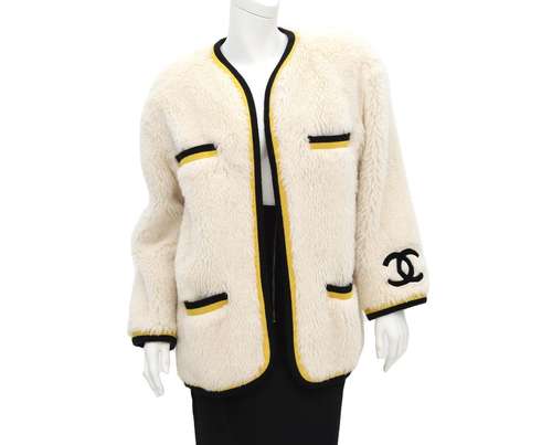 A Chanel Boutique Faux fur coat incl. cover (large fit). A v...