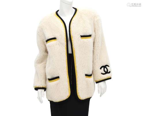 A Chanel Boutique Faux fur coat incl. cover (large fit). A v...