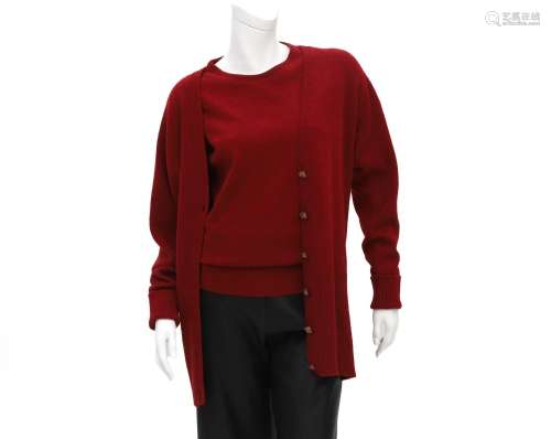 A burgundy red Chanel twin set of a sweater and a cardigan. ...