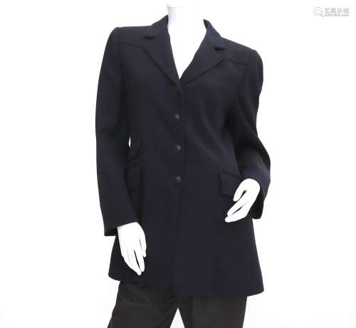 A black wool Hermès blazer. Three pockets at the front and f...