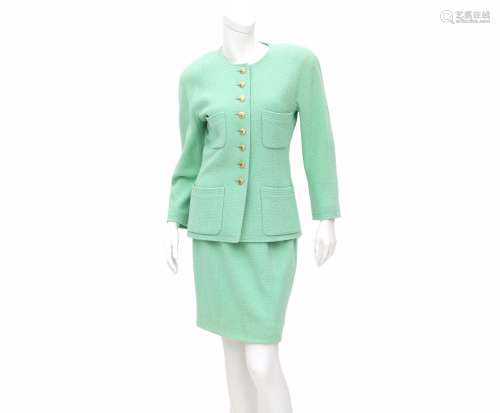 A Chanel Boutique ensemble of a pastel green blazer and skir...