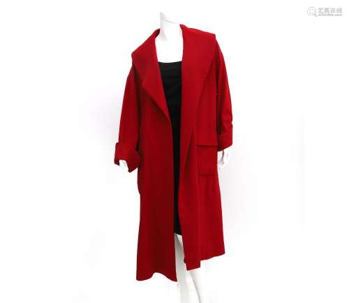 A red wool Chanel Boutique coat. A larger size model with a ...