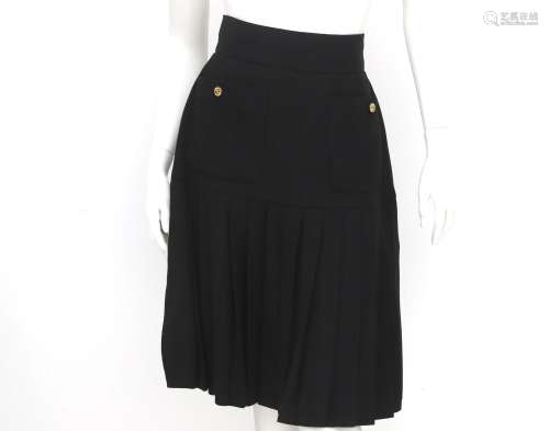 A Chanel Boutique skirt black with pleats at the bottom. The...