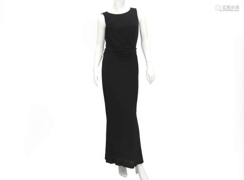 A black Chanel Boutique evening wrap dress. The dress is mad...