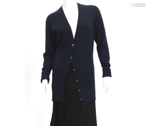 A dark blue wool Chanel vest. A V-neck and six cc logo butto...