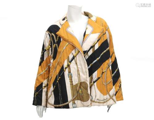 A silk Hèrmes jacket. A quilted all over print in ocher, cre...