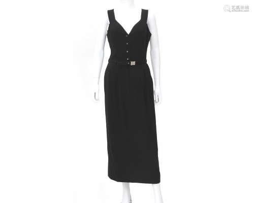A Chanel Boutique black dress with belt. The belt has a silv...