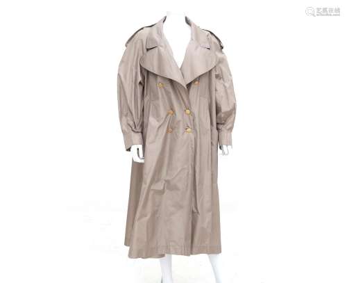A camel Chanel Boutique trench coat. Comes with a matching b...