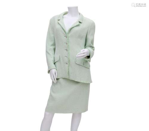 A Chanel Boutique ensamble a green and white mixed blazer an...