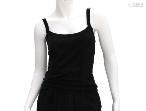 A Chanel Boutique tank top. The tank top has wide shoulder s...