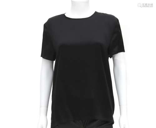 A black Chanel short sleeve blouse. With a gold-colored CC l...