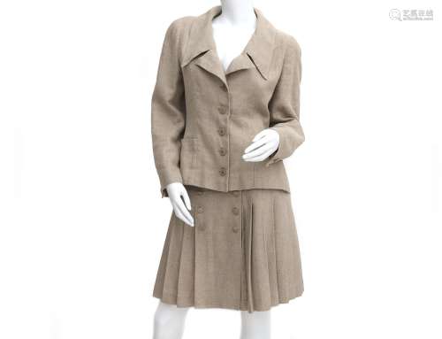 A Beige linen Chanel Boutique ensemble of a blazer and skirt...