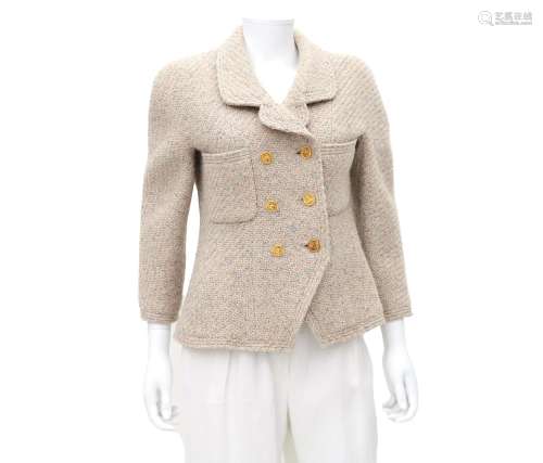A beige Chanel Boutique jacket. Incl. fabric sample & bu...