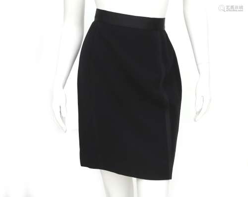 A black Chanel pencil skirt with stripe details down the len...
