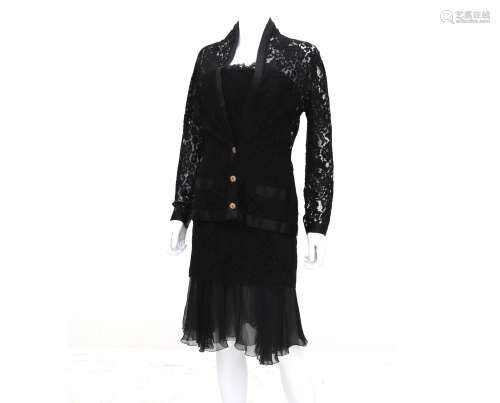 A Chanel Boutique ensemble of a lace black dress, blazer and...