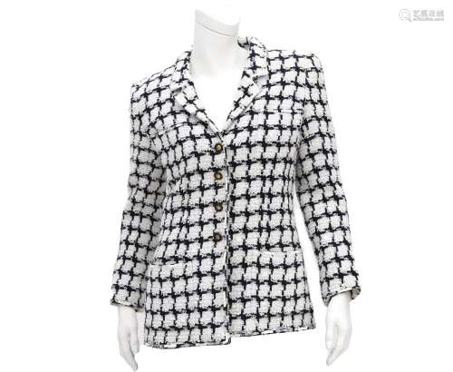 A Chanel Boutique black and white checked blazer. with two o...