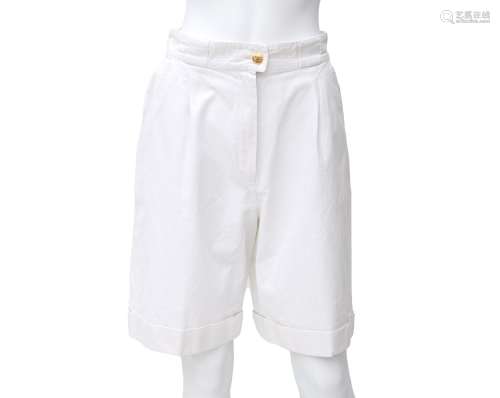 A Chanel Boutique white Bermuda pants. It has two back pocke...