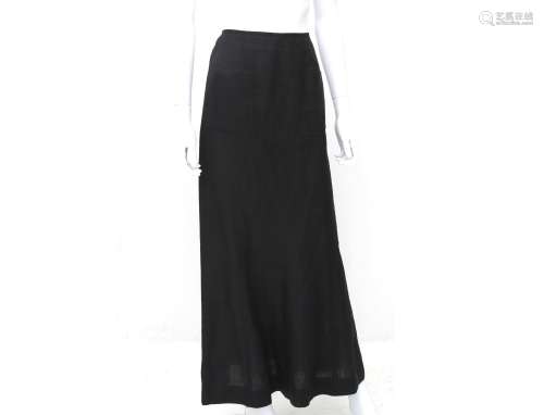 A Chanel Boutique long black linen skirt. A wide model towar...