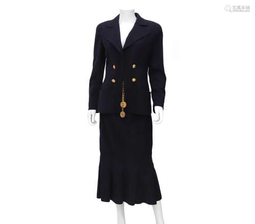 A dark blue Chanel Boutique ensemble. Embellished with gold ...