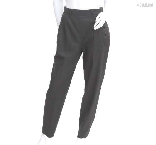 A pair of gray mixed Hermès trousers. Pleated legs, with zip...