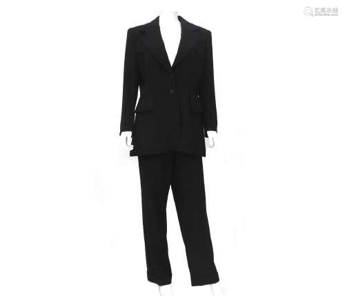 A black Hermès suit, a blazer and trousers, incl. garment ba...